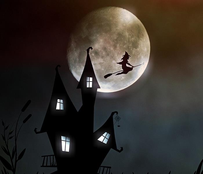 artistic rendering of a spooky house with a witch flying in front of a full moon